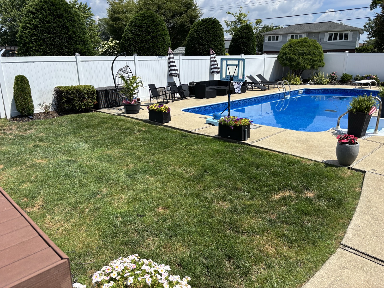 The in-ground swimming pool and patio